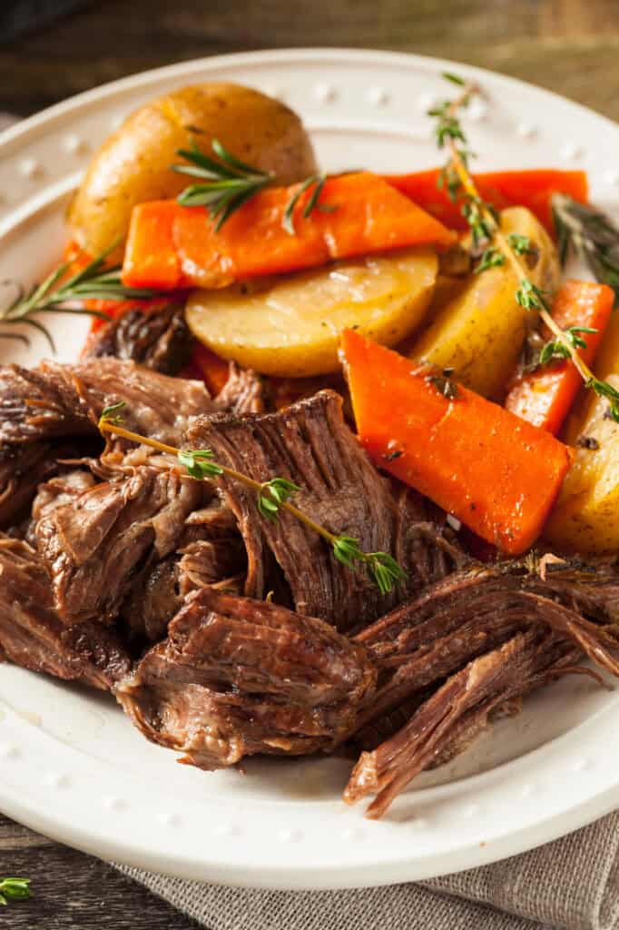 easy crock pot roast with vegetables on a white plate
