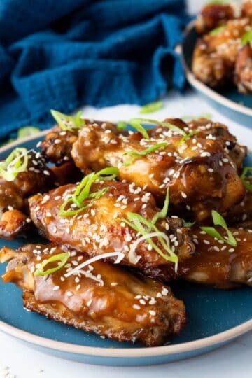 Asian Sticky Chicken Wings served on a blue plate