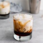 glass of Classic White Russian Cocktail being served