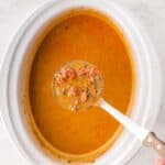 Creamy Crockpot Taco Soup being served out of the slow cooker with a ladle