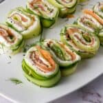 Everything Bagel Cucumber Rolls served on white plate sitting on the counter
