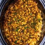 slow cooker chicken and stuffing in a black crock pot