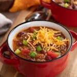 easy crock pot beef chili recipe in a red bowl