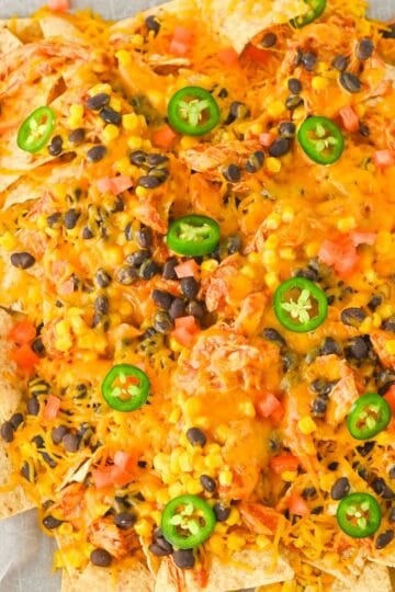 crockpot chicken nachos featured and served on a white plate