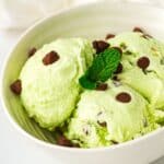 scoops of Mint Chocolate Chip Ninja Creami Ice Cream served in a white bowl