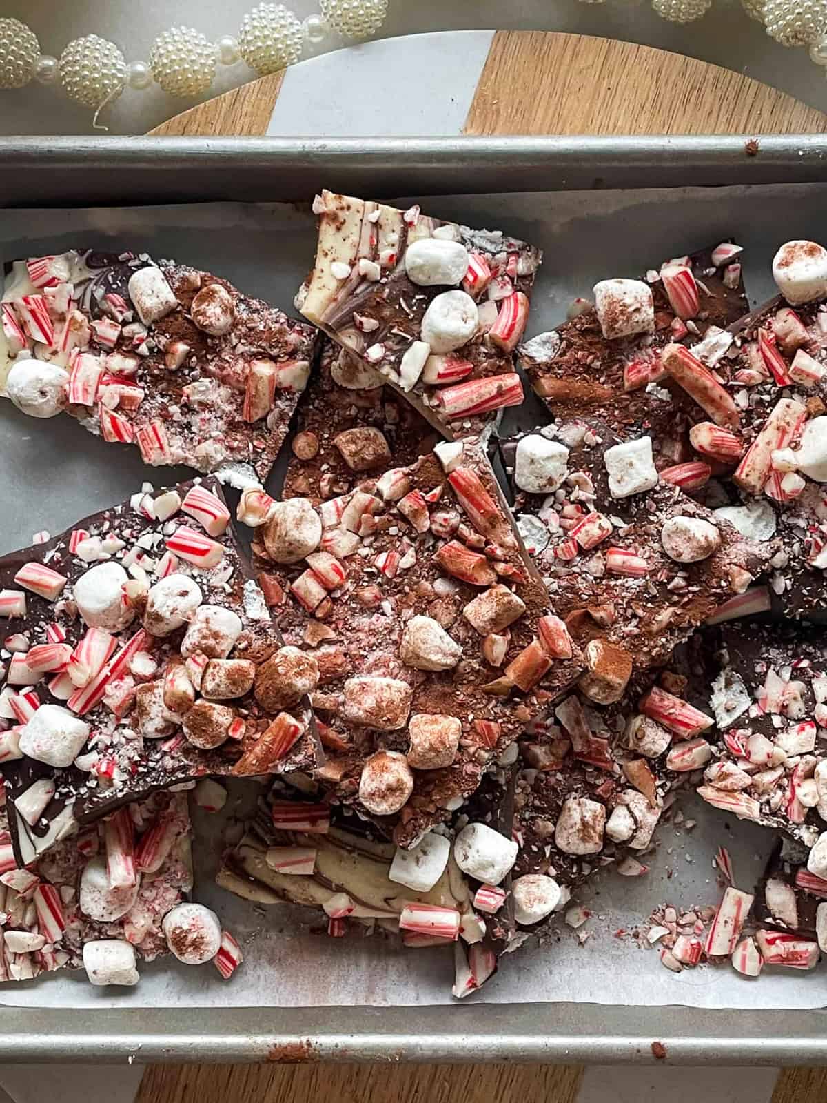 hot chocolate bark recipe on a sheet pan after cooking