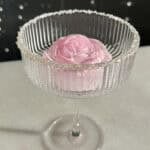 a rose ice cube with prosecco to make a Bridgerton cocktail