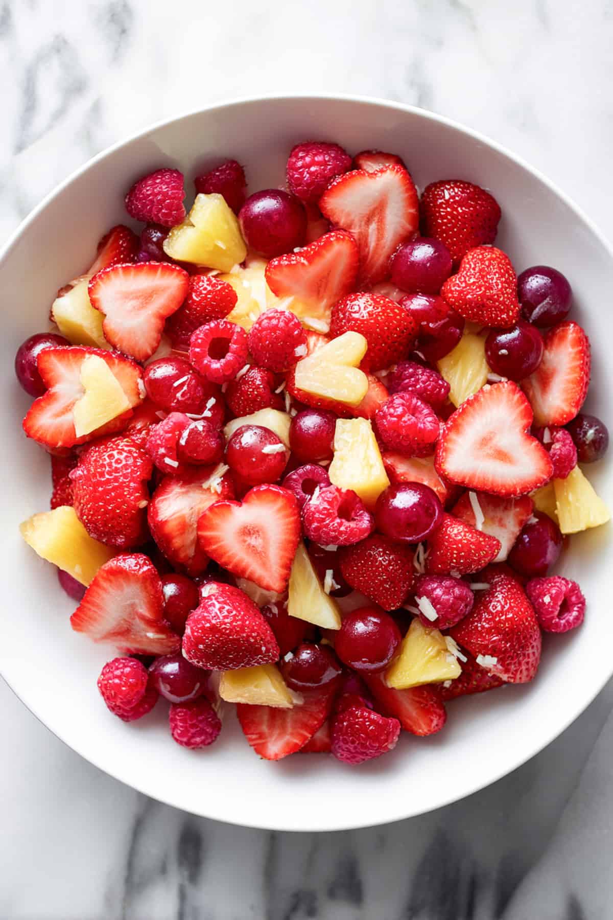 an easy valentines fruit salad with strawberry hearts