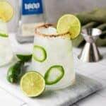 Spicy margarita drink with freshly sliced lines.
