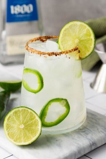 Spicy margarita drink with freshly sliced lines.