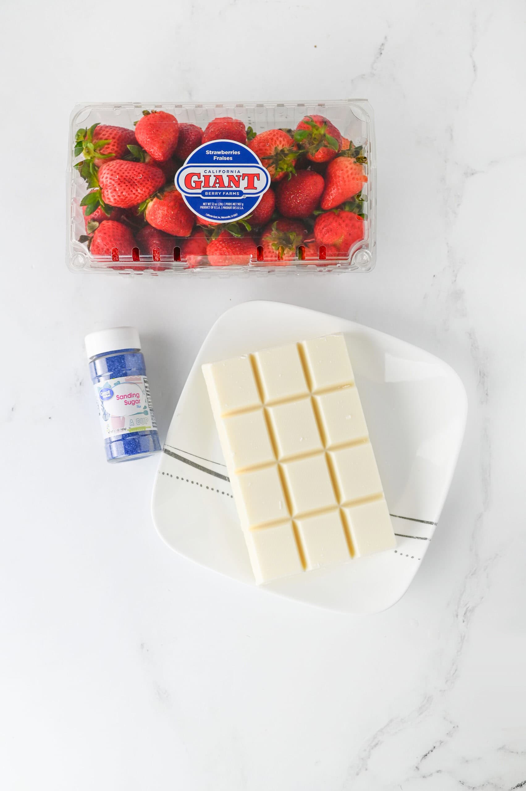 Image of ingredients needed to make red white and blue dipped strawberries.