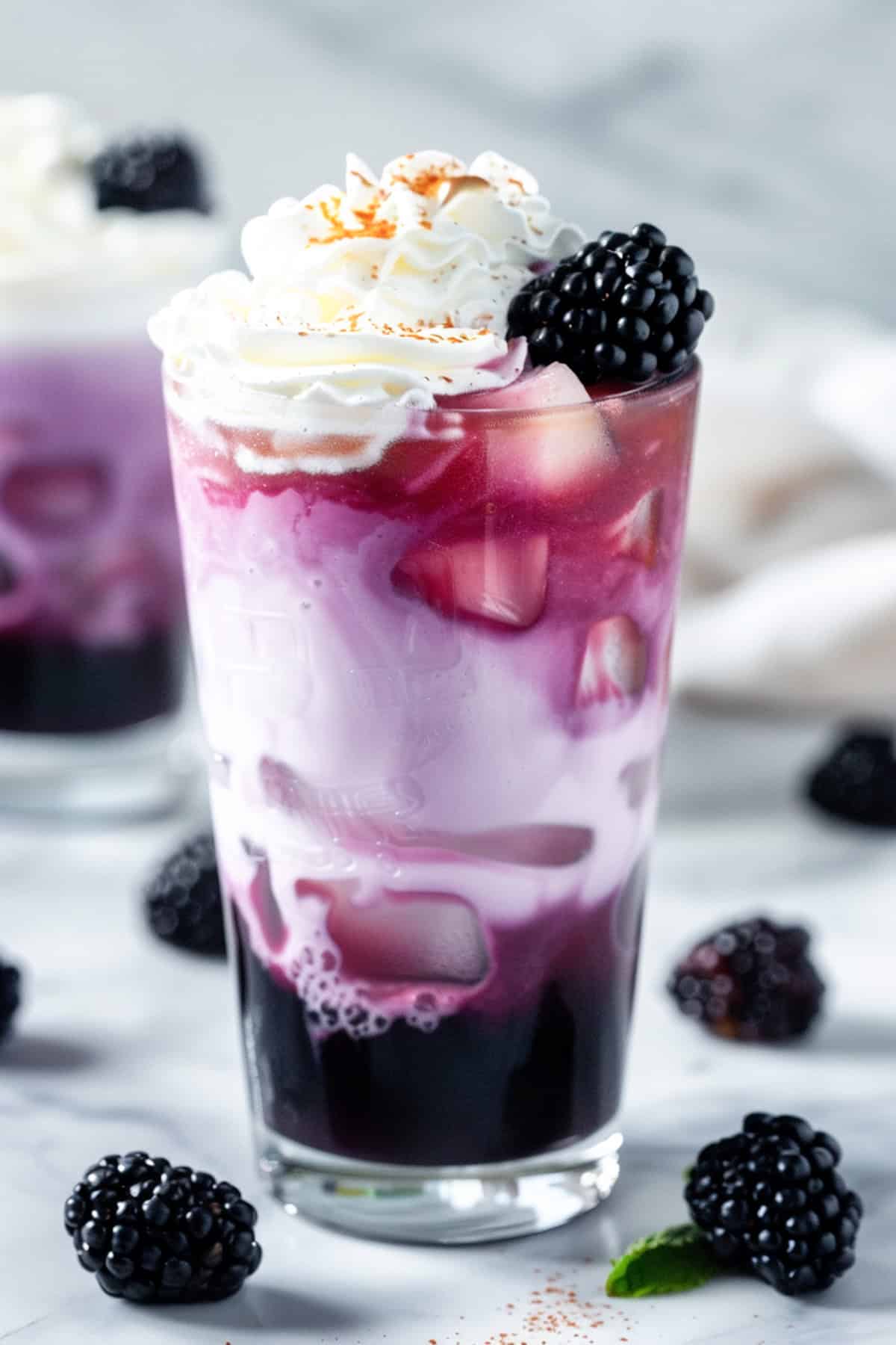 blackberry cream dirty soda with sprite on a white background