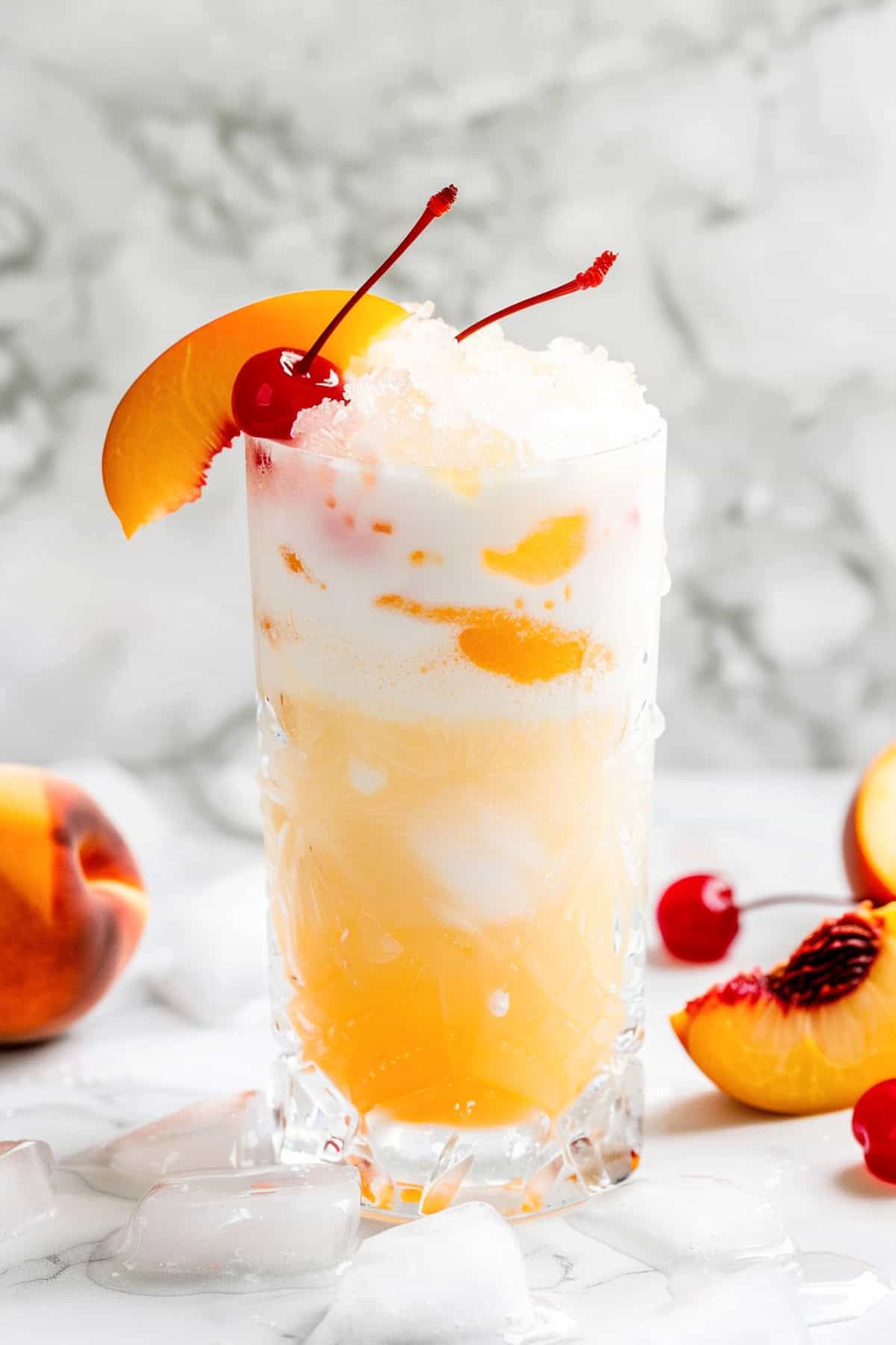 peaches and cream dirty soda with sprite garnished with peach slices and cherries