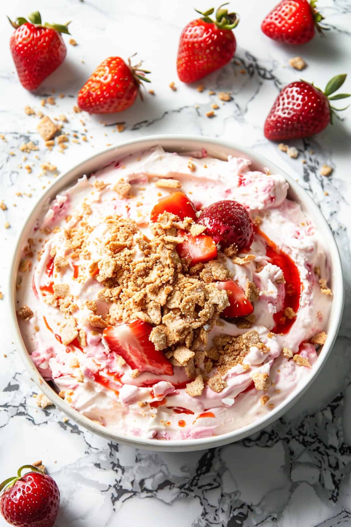 no bake strawberry cheesecake dip in a white bowl