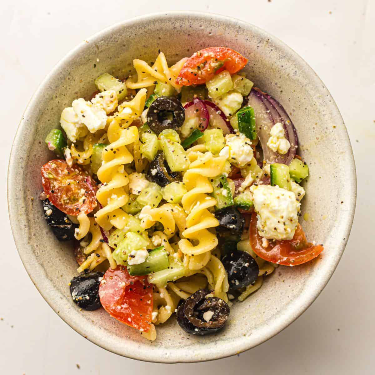 Greek pasta salad served in a bowl.