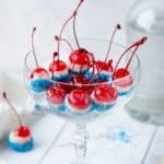 Red white and blue cherry bombs in a clear glass for presentation.