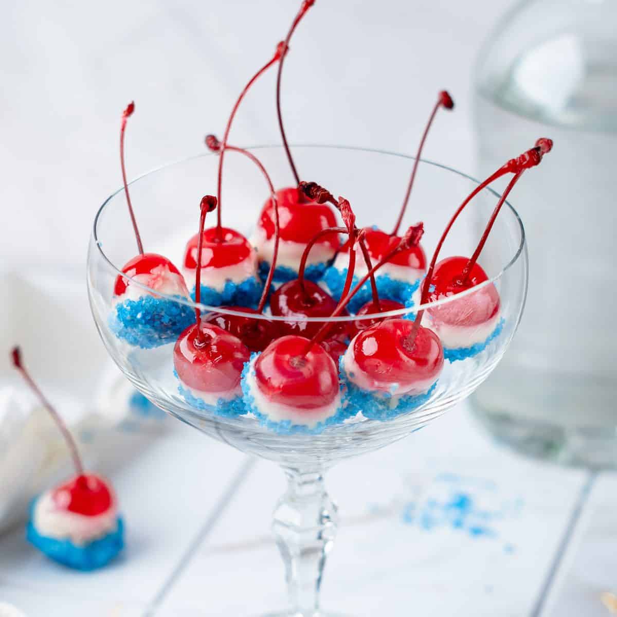 Red white and blue cherry bombs in a clear glass for presentation.