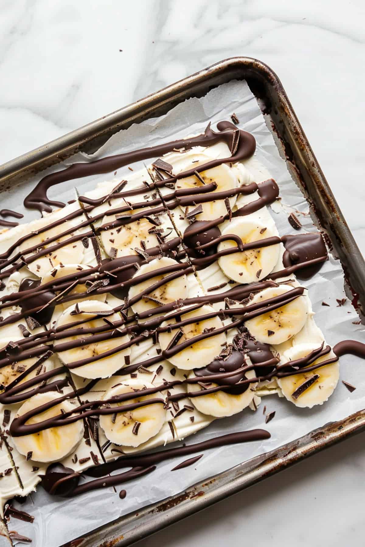 chocolate banana greek yogurt bark on a cookie sheet