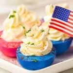 red white and blue deviled eggs with American flag.