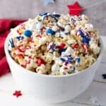 Bowl of red white and blue popcorn.