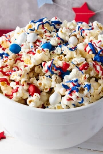 Bowl of red white and blue popcorn.