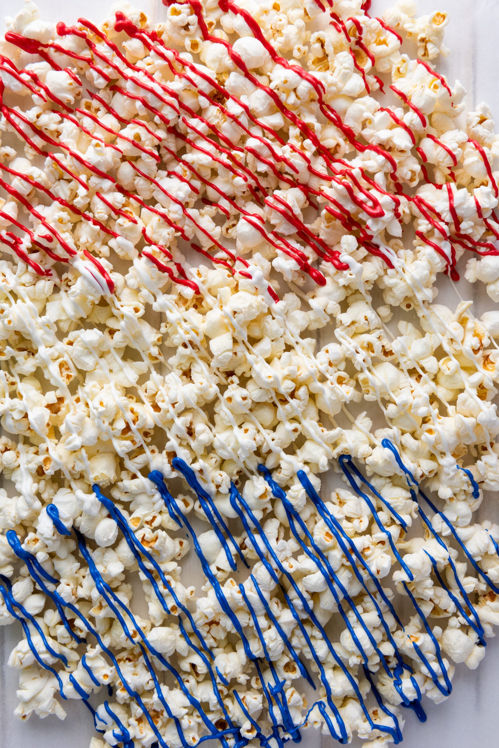 Popcorn drizzled in red, white, and blue chocolate.