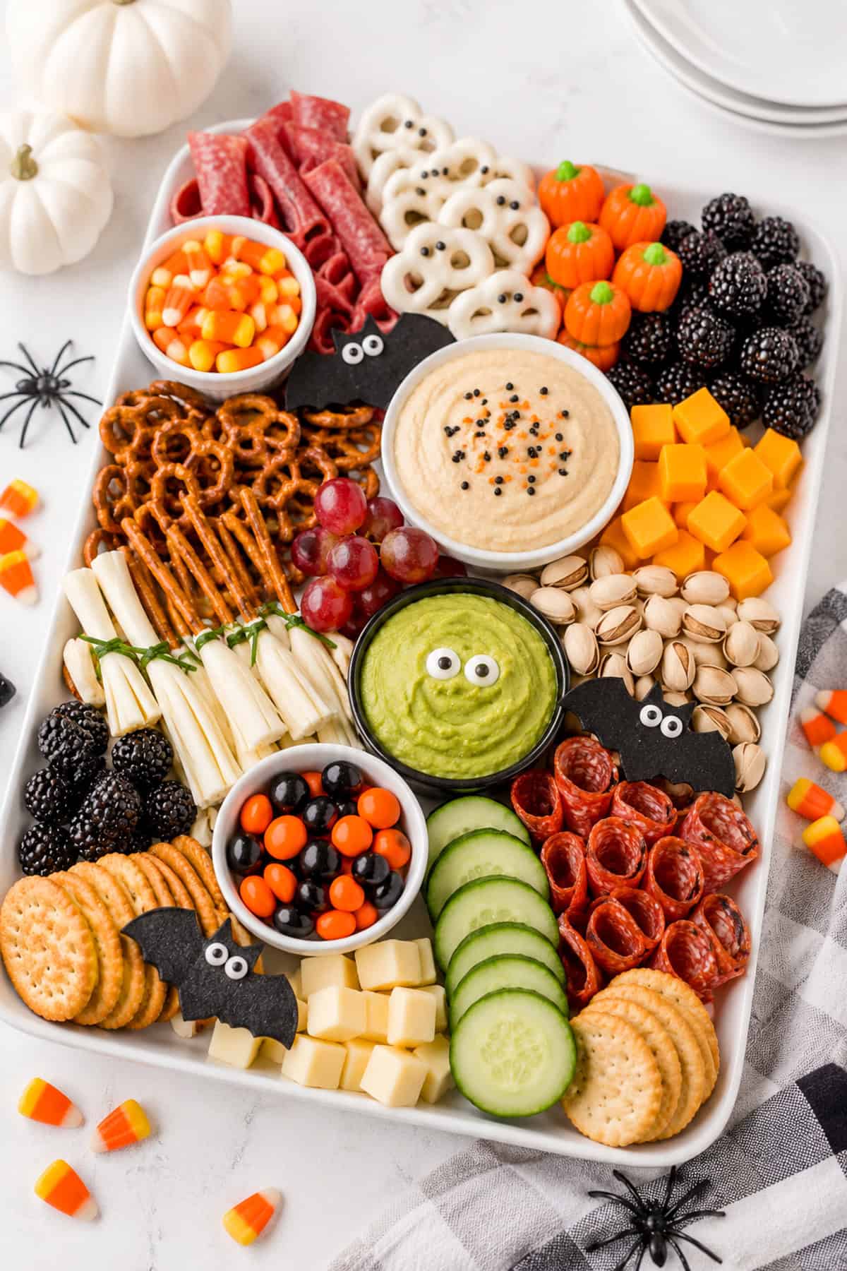 a halloween charctuerie board with sweet and savory options makes the best halloween party finger foods