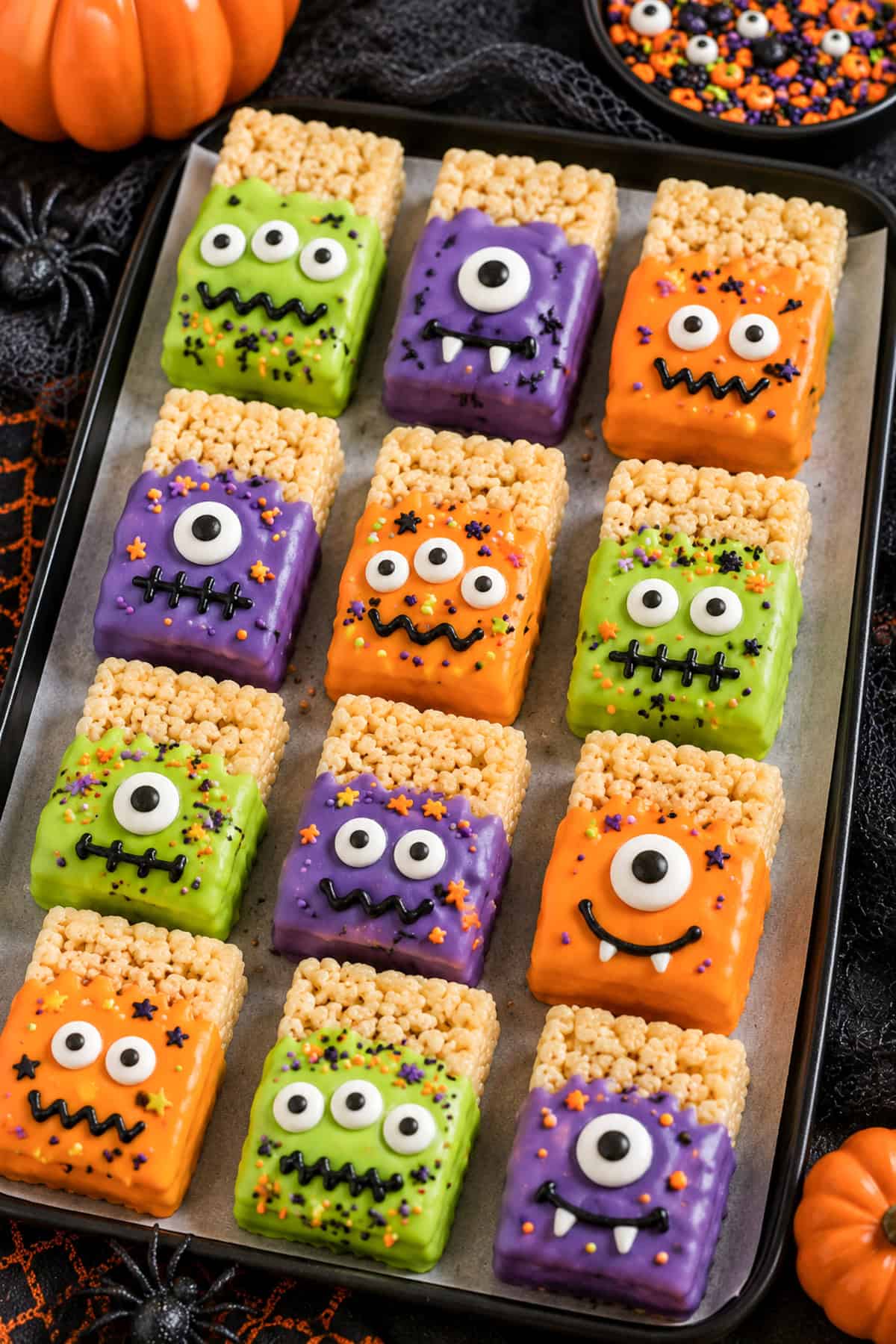 monster rice crispy treats decorted with candy eyeballs and frosting
