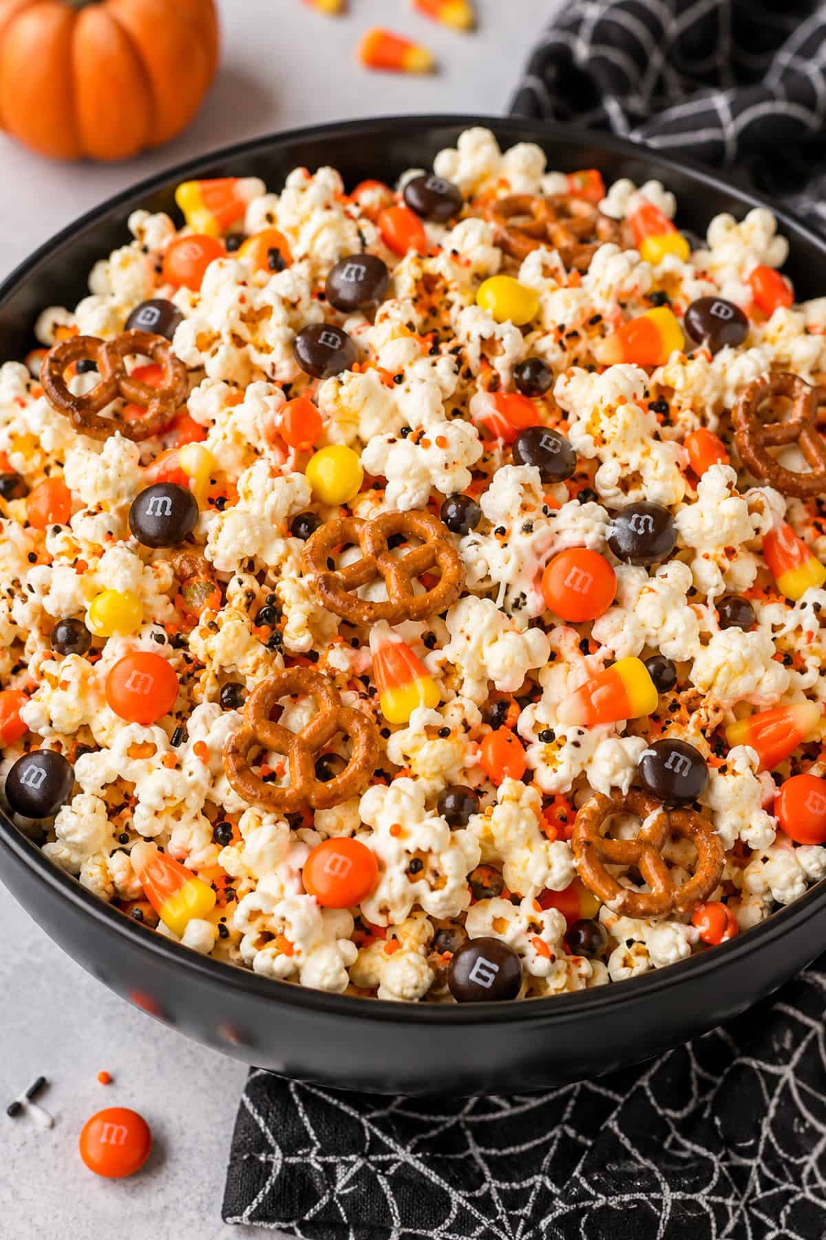 halloween popcorn mix in orange brown and yellow candies
