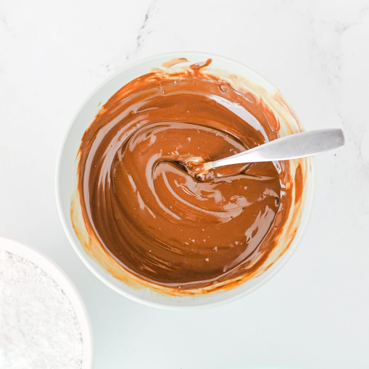 melt the chocolate for the halloween muddy buddy recipe