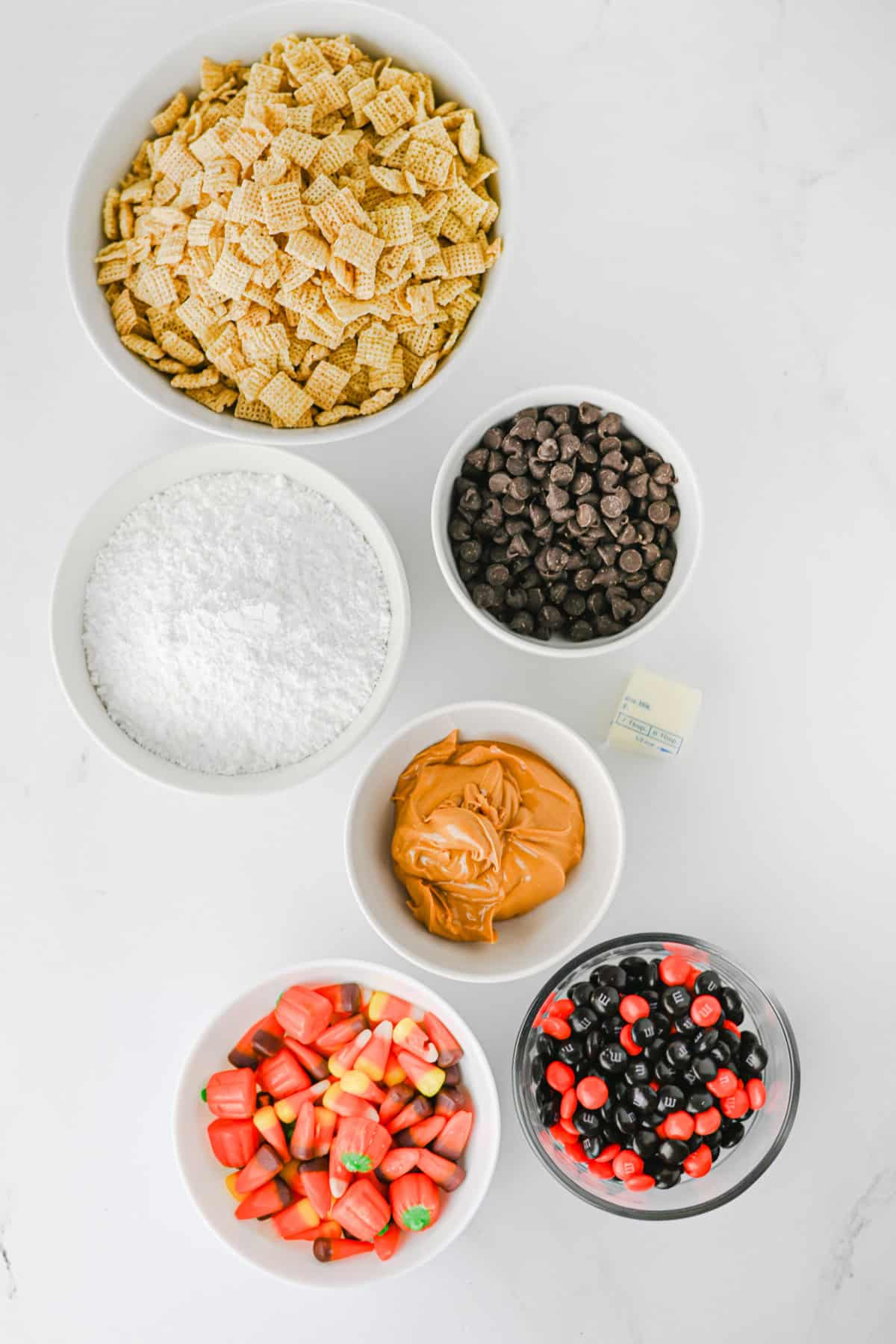 halloween muddy buddy ingredients on a white counter