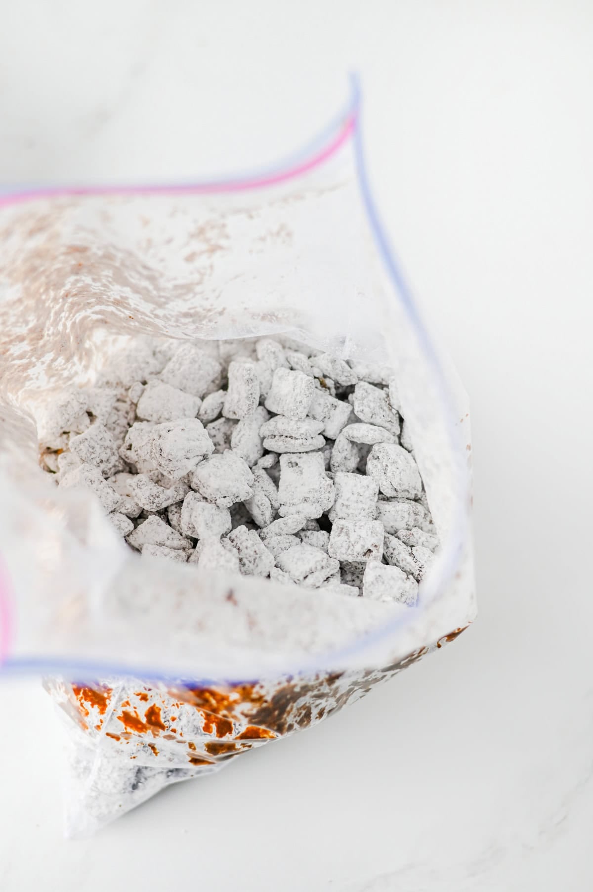 shake the muddy buddy mixture in a plastic bag