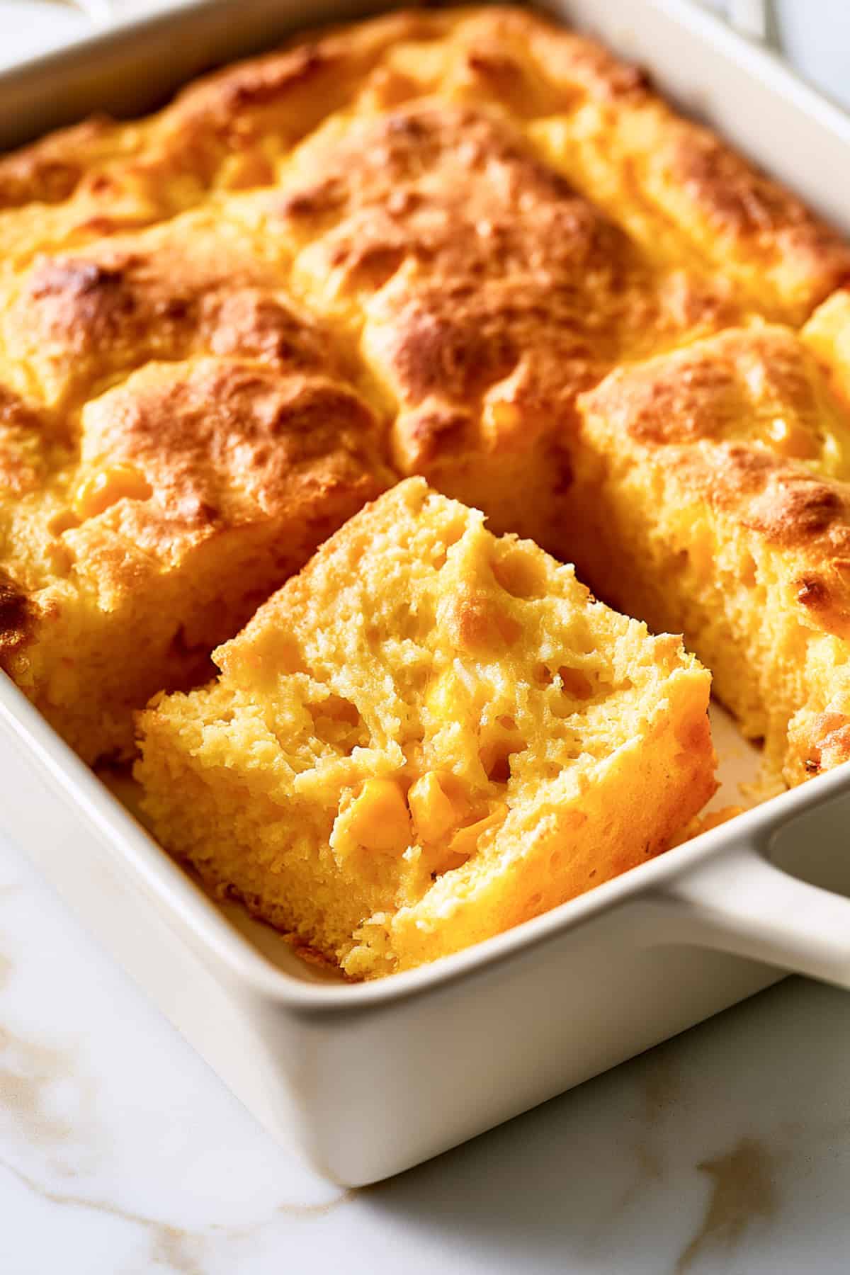 jiffy corn casserole in a white casserole dish