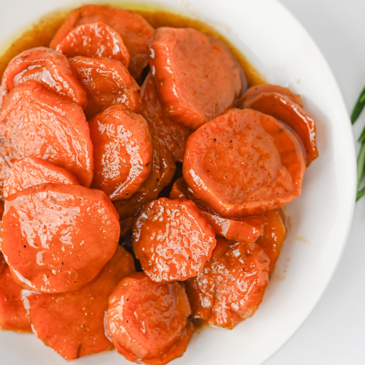 Roasted sweet potato slices glazed with orange marmalade style glaze.